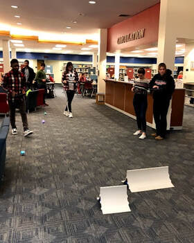 Picture Students using Sphero Robots with  iPads racing on ramps